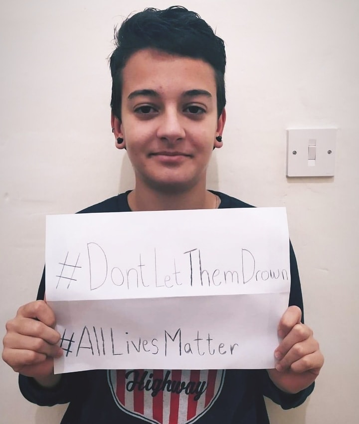 Matthew participating in the #DontLetThemDrown campaign.